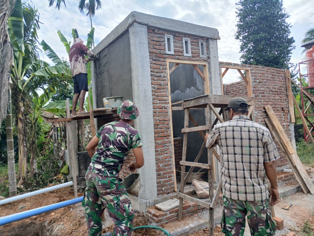 Kerjasama Satgas TMMD dan Masyarakat dalam Pembangunan Fasilitas Sanitasi di TPU Blang Cot